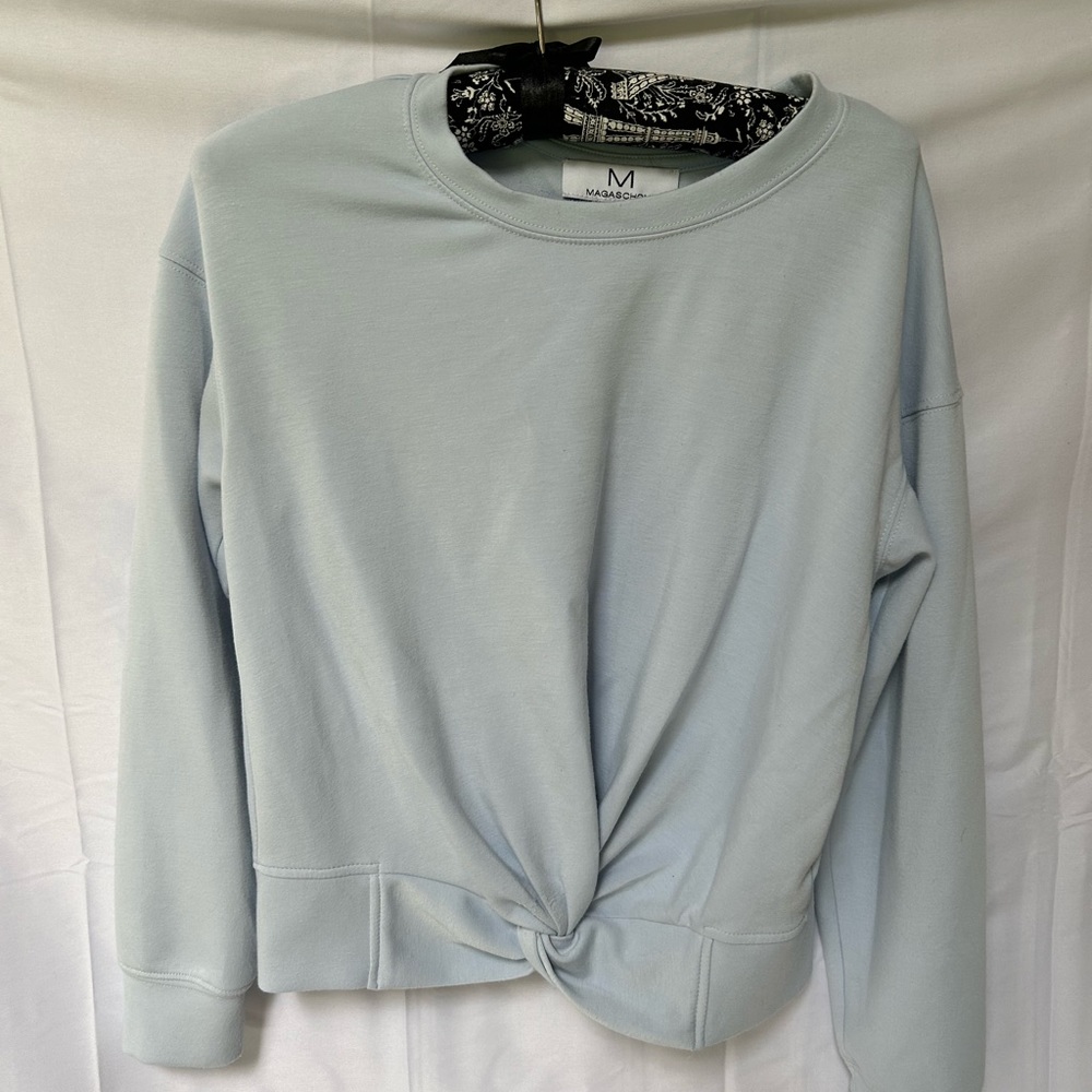 Magaschoni light blue sweatshirt with cropped twist design bottom Sz XS
